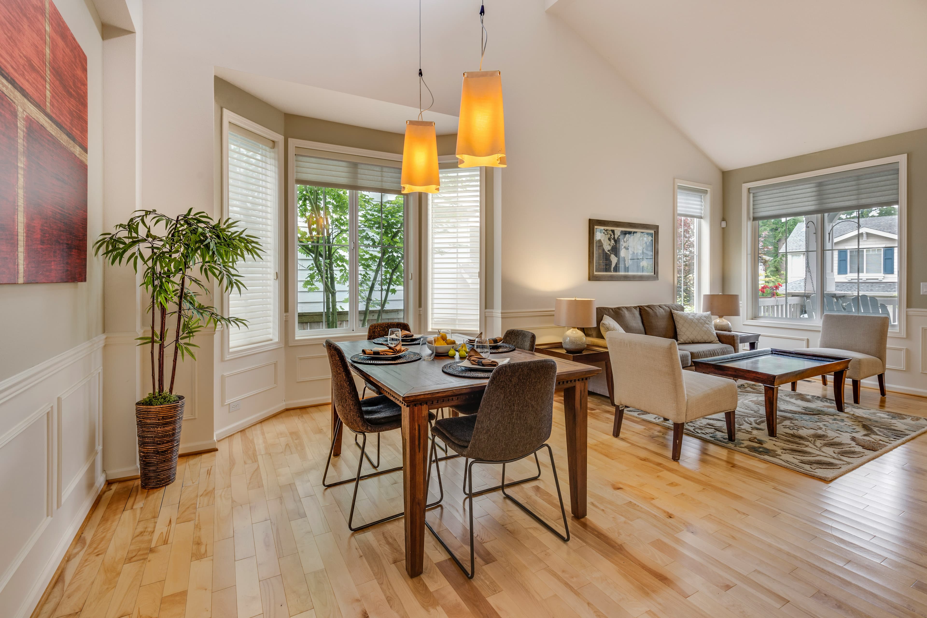 Open plan dining and living with bay windows